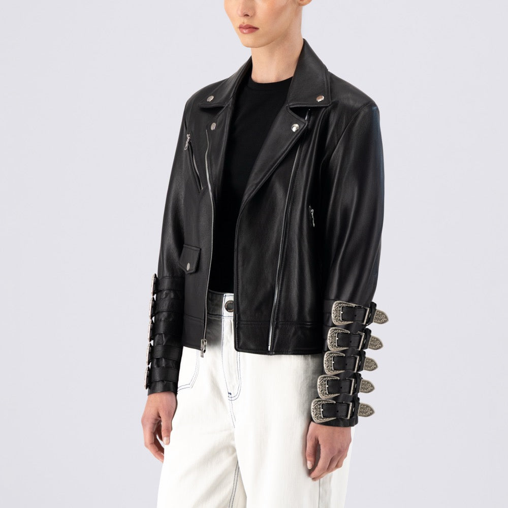 Black leather jacket with unique sleeve designs worn by a model on a light gray background