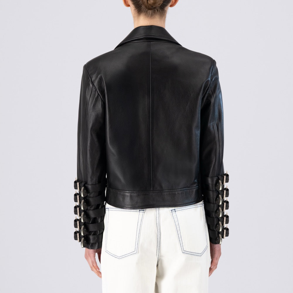 Black leather jacket with unique sleeve designs on a plain background